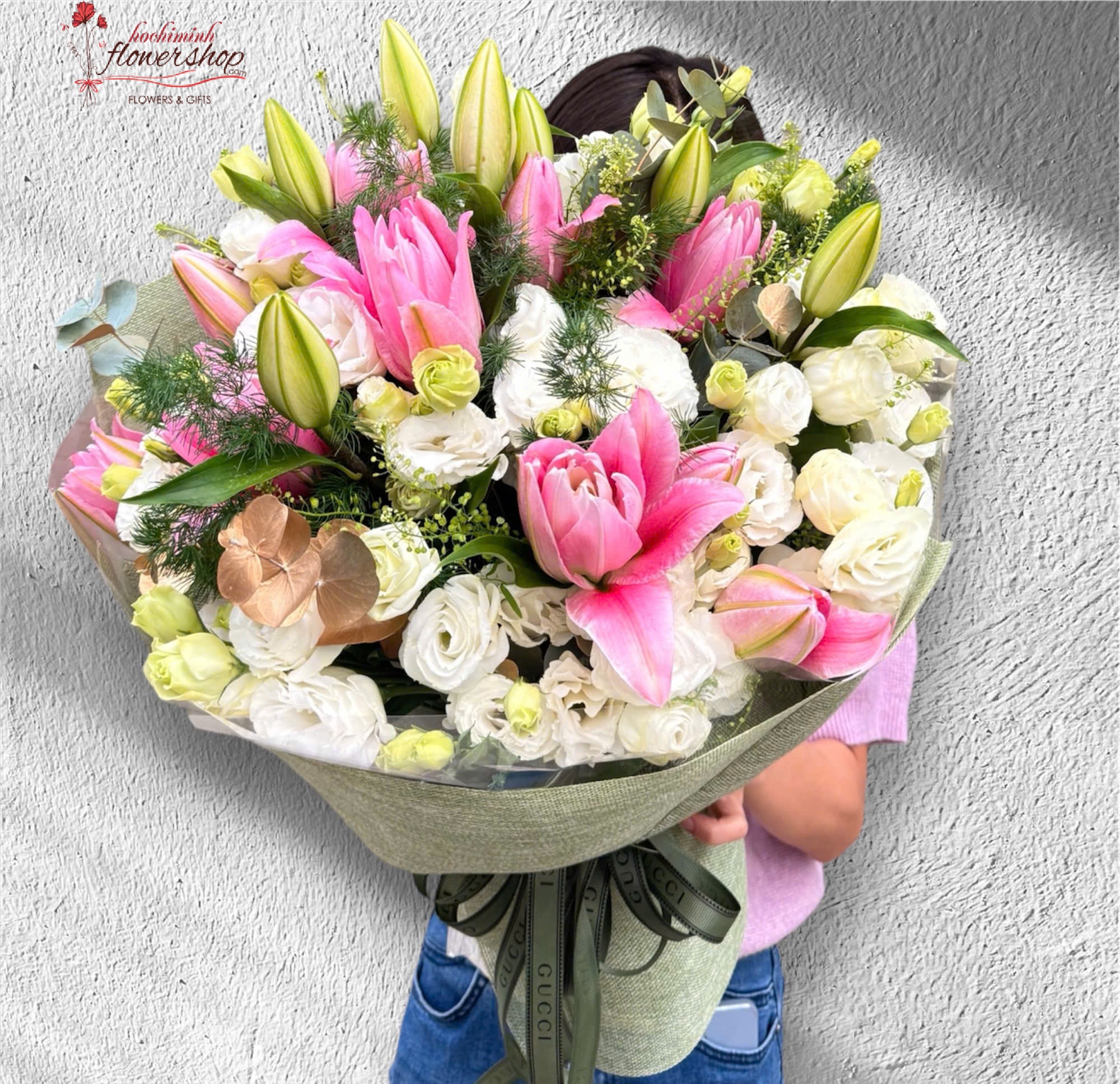 Pink lilies are planted interspersed with white carnations