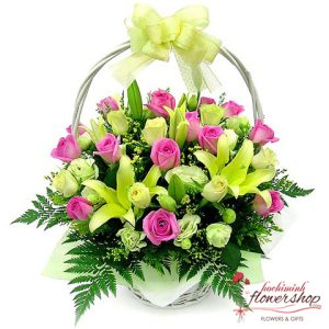 Basket of pink roses and yellow lilies