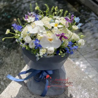 White and blue birthday flower bouquet with orchids in Ho Chi Minh City