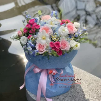 Mixed flower birthday bouquet with pink roses, tulips and blue hydrangea in Ho Chi Minh